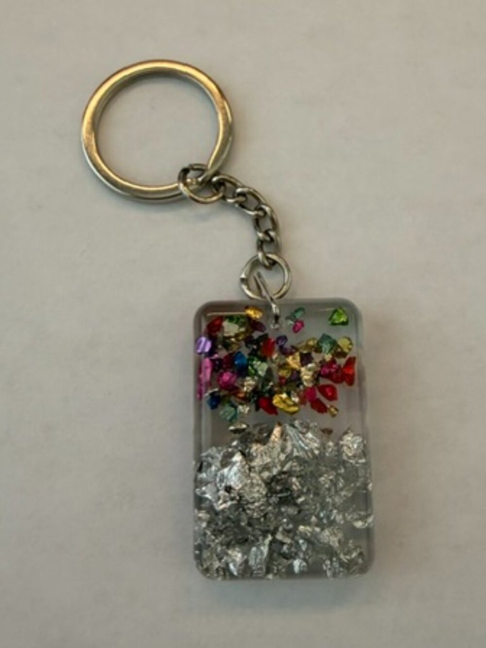 Handcrafted Resin Keychain – Silver Foil & Multi-Color Confetti Sparkle